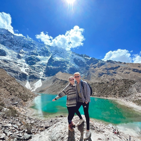 Couple enjoying the landscape of Humantay Lake | Ultimate Trekking