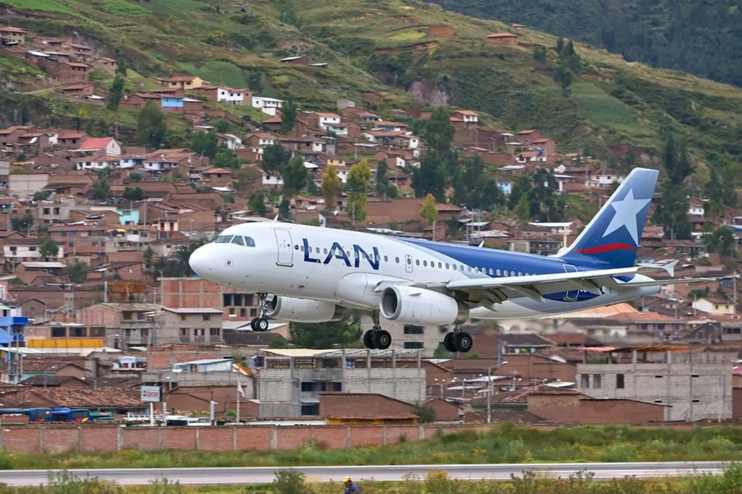 LAN airplane taking off from Cusco airport | Ultimate Trekking