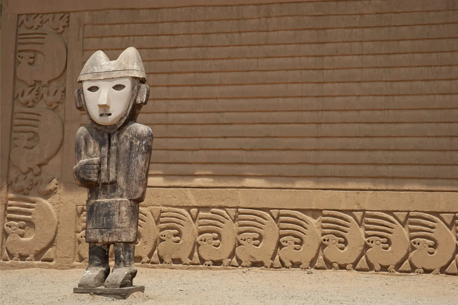 Wooden sculpture at Chan Chan, a famous landmark in Peru made of adobe