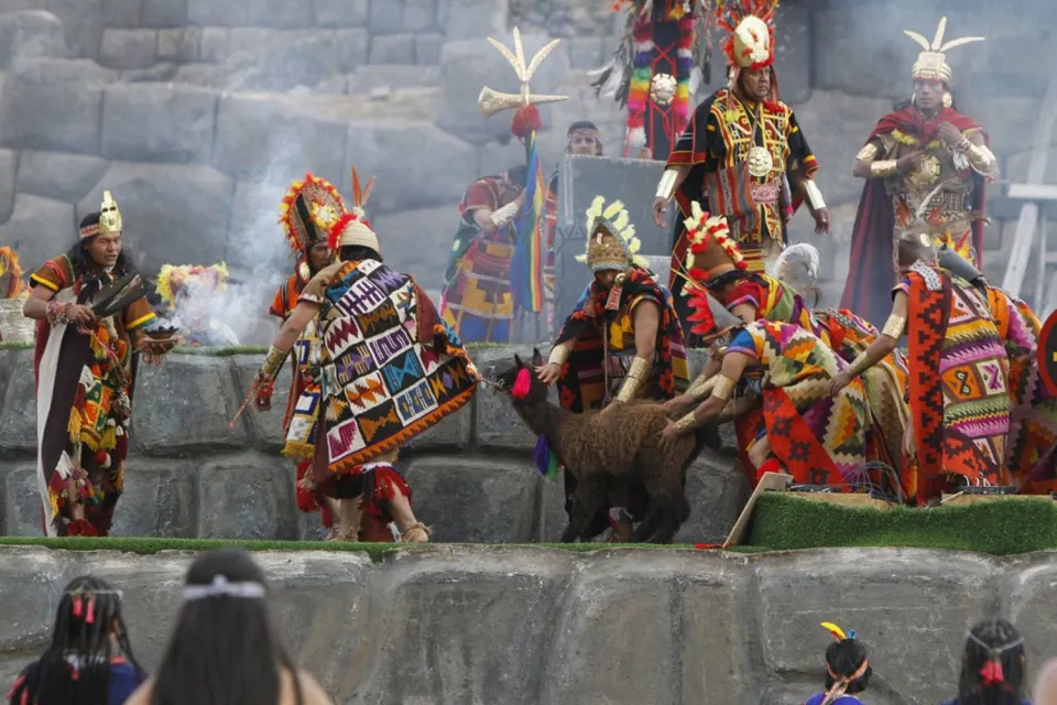 sacrifice of a llama in the staging of inti raymi | Ultimate Trekking