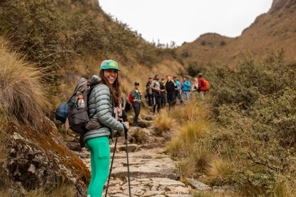 Tourist climbing steps on the Inca Trail | Ultimate Trekking