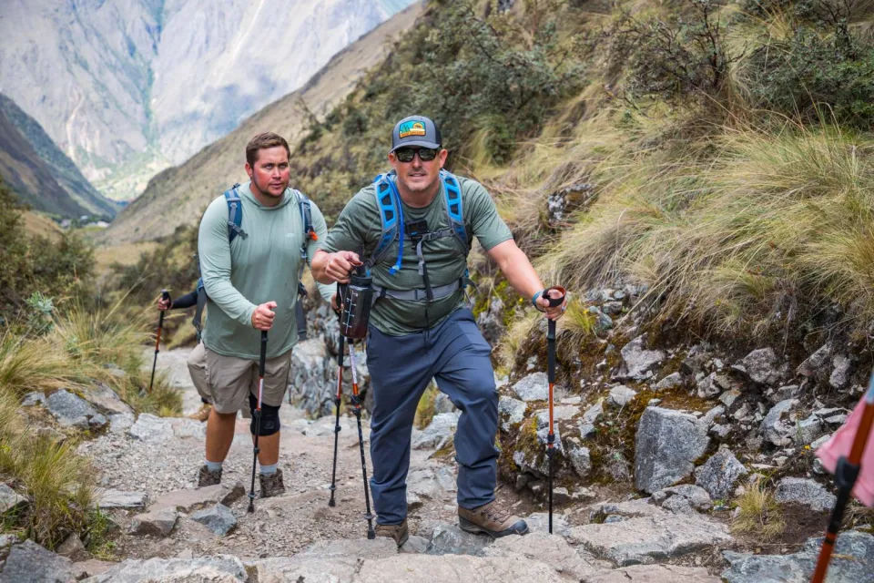 Tourists walking with their trekking poles on the Inca trail | Ultimate Trekking