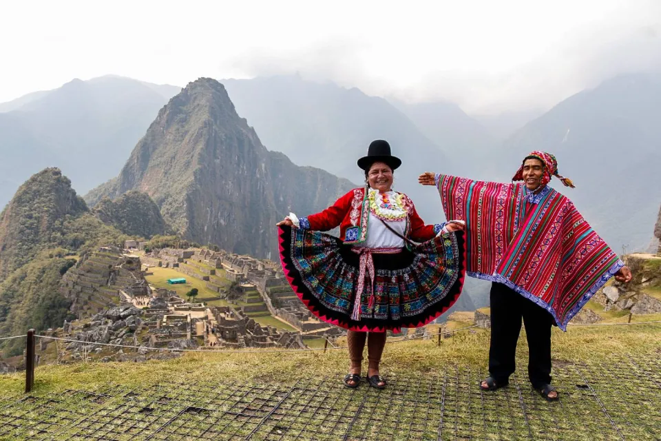 Two Quechua people visiting Machu Picchu | Ultimate Trekking