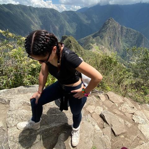 Girl resting on the climb to Machu Picchu mountain | Ultimate Trekking