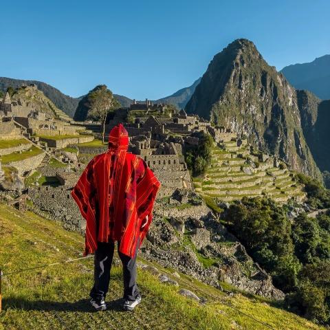 boy posing at the bottom of Machu Picchu | Ultimate Trekking