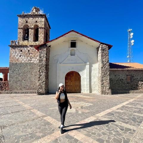 Tourist walking through Chucuito by the temple of fertility | Ultimate Trekking
